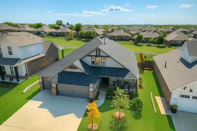3760 Black Mesa Rd, Norman, OK 73071 - view of front of home featuring a residential view, stone siding, an attached garage, driveway, and roof with shingles