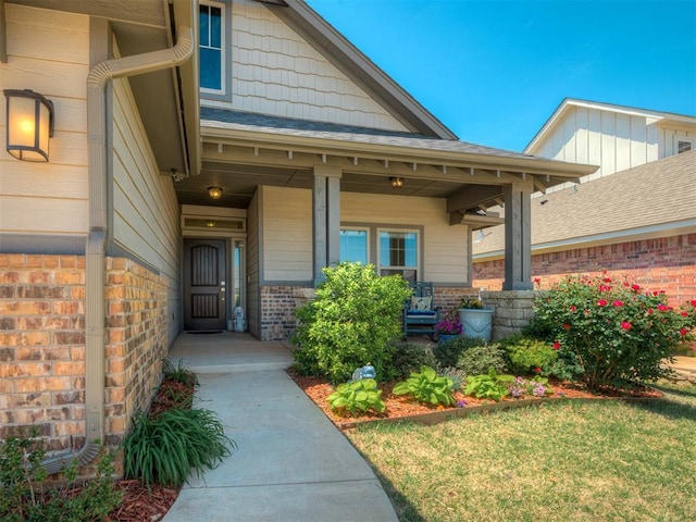 3760 Black Mesa Rd, Norman, OK 73071 - entrance to property featuring a porch, brick siding, and a yard