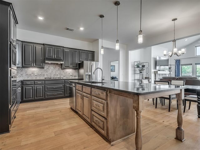 3760 Black Mesa Rd, Norman, OK 73071 - kitchen featuring dark countertops, stainless steel appliances, backsplash, light wood finished floors, and recessed lighting
