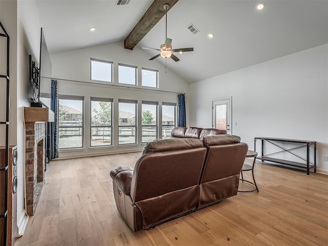 3760 Black Mesa Rd, Norman, OK 73071 - living area featuring beamed ceiling, ceiling fan, a fireplace, light wood-style flooring, and high vaulted ceiling
