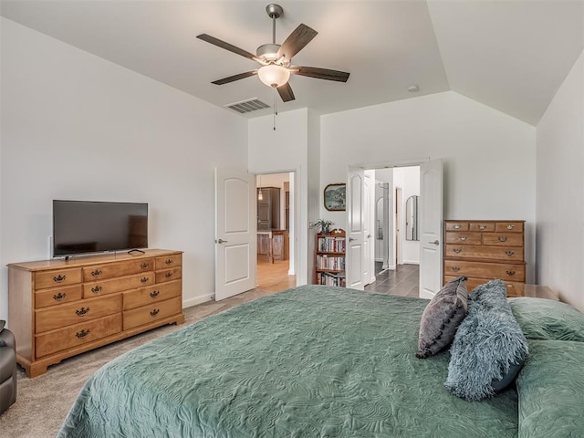 3760 Black Mesa Rd, Norman, OK 73071 - carpeted bedroom featuring vaulted ceiling, ensuite bath, and ceiling fan