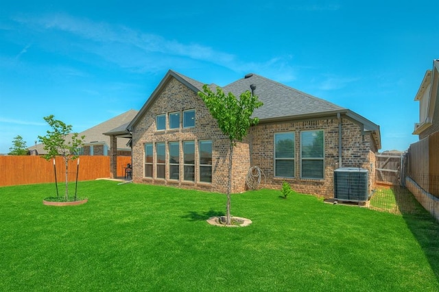 3760 Black Mesa Rd, Norman, OK 73071 - back of house with brick siding, a fenced backyard, and a shingled roof
