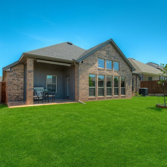 3760 Black Mesa Rd, Norman, OK 73071 - rear view of house with brick siding, a patio area, and a shingled roof