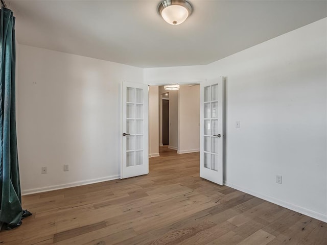 3760 Black Mesa Rd, Norman, OK 73071 - spare room with french doors and wood finished floors