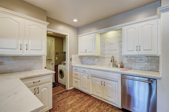 12108 Blue Sage Rd, Oklahoma City, OK 73120 - kitchen featuring stainless steel dishwasher, washer / dryer, decorative backsplash, white cabinetry, and recessed lighting