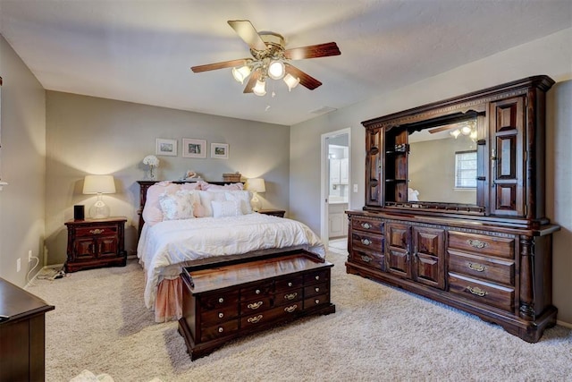 12108 Blue Sage Rd, Oklahoma City, OK 73120 - bedroom with light colored carpet, ceiling fan, and connected bathroom