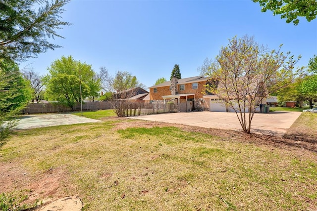 12108 Blue Sage Rd, Oklahoma City, OK 73120 - view of yard featuring concrete driveway
