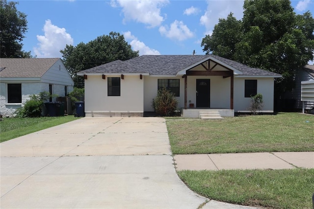 1361 Chestnut Dr, Oklahoma City, OK 73119 - view of front of house featuring a front lawn, driveway, and stucco siding