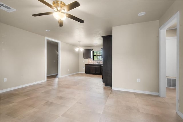 1361 Chestnut Dr, Oklahoma City, OK 73119 - unfurnished living room with a ceiling fan and a chandelier