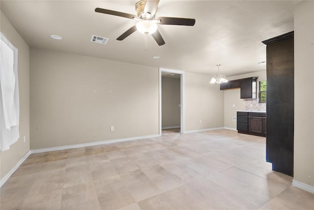 1361 Chestnut Dr, Oklahoma City, OK 73119 - unfurnished living room featuring a ceiling fan and a chandelier