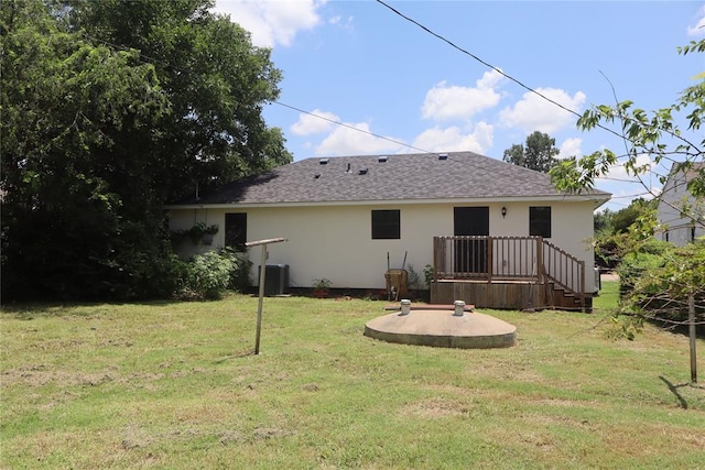 1361 Chestnut Dr, Oklahoma City, OK 73119 - rear view of property featuring stucco siding, a yard, and roof with shingles