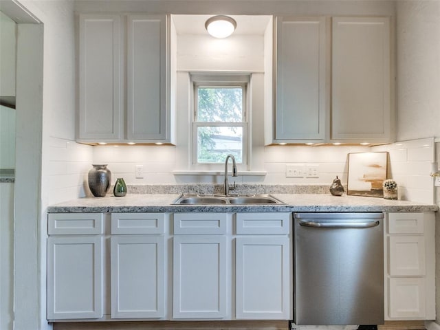 610 N Choctaw Ave, El Reno, OK 73036 - kitchen with dishwasher, backsplash, and white cabinets