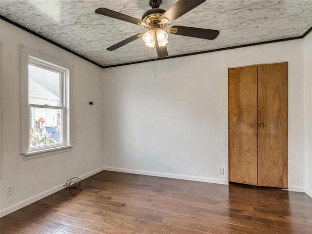 610 N Choctaw Ave, El Reno, OK 73036 - unfurnished room featuring wood finished floors, ceiling fan, and ornamental molding