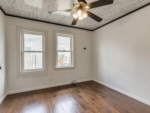 610 N Choctaw Ave, El Reno, OK 73036 - empty room featuring dark wood-type flooring and a ceiling fan