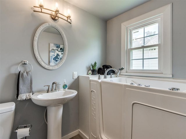 610 N Choctaw Ave, El Reno, OK 73036 - bathroom with toilet and a bath