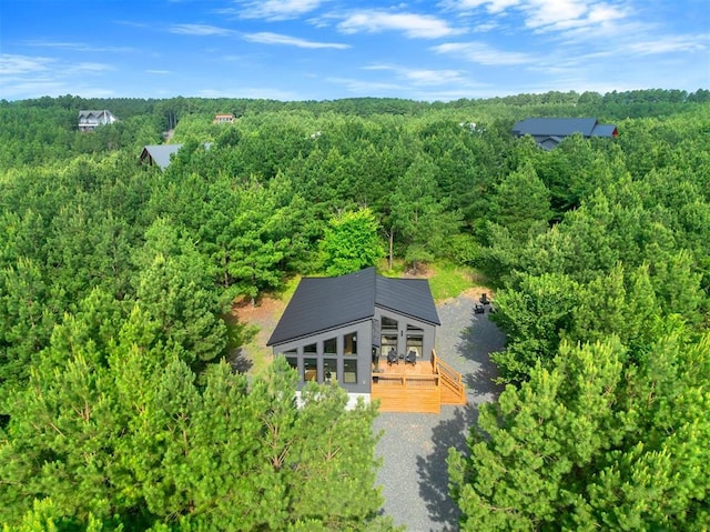105 S Spruce Trl, Broken Bow, OK 74728 - aerial view of property and surrounding area featuring a heavily wooded area