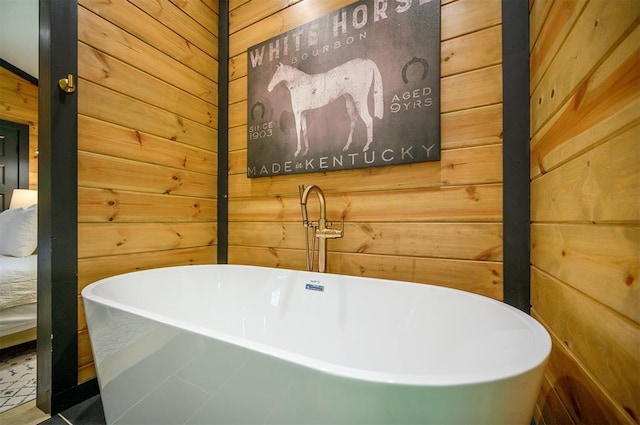 105 S Spruce Trl, Broken Bow, OK 74728 - bathroom with wood walls and a freestanding tub