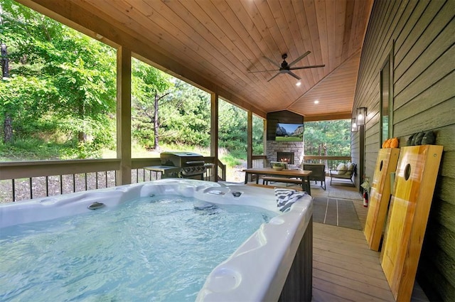 105 S Spruce Trl, Broken Bow, OK 74728 - wooden terrace featuring an outdoor stone fireplace, grilling area, a hot tub, and ceiling fan