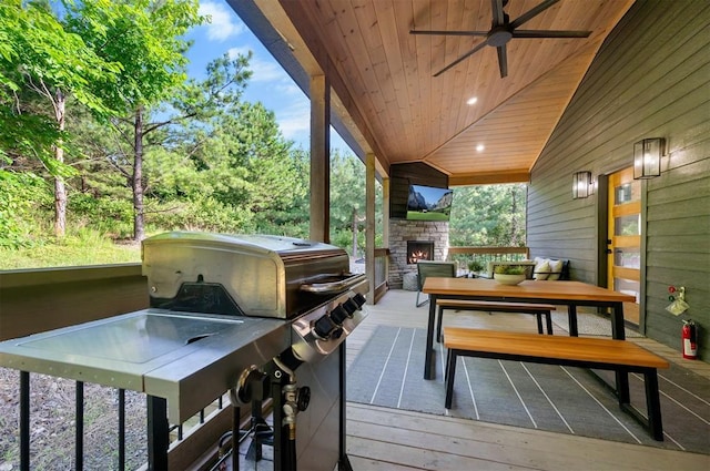 105 S Spruce Trl, Broken Bow, OK 74728 - deck featuring an outdoor stone fireplace and ceiling fan