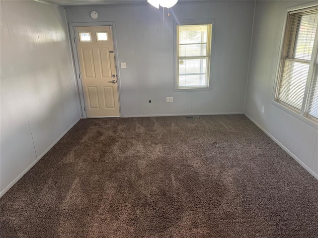 818 W Watts St, El Reno, OK 73036 - carpeted foyer featuring healthy amount of natural light and a ceiling fan