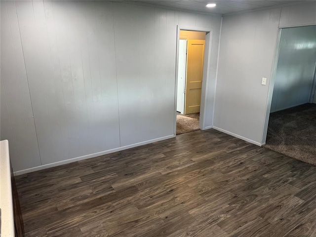 818 W Watts St, El Reno, OK 73036 - spare room featuring dark wood finished floors and baseboards