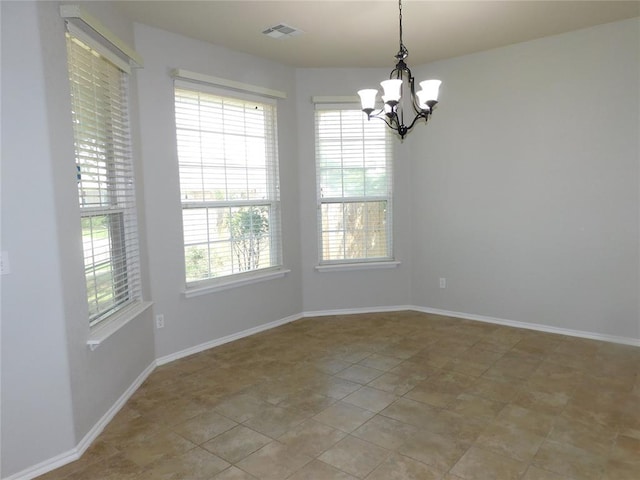 6036 SE 66th St, Oklahoma City, OK 73135 - unfurnished room featuring a chandelier and plenty of natural light