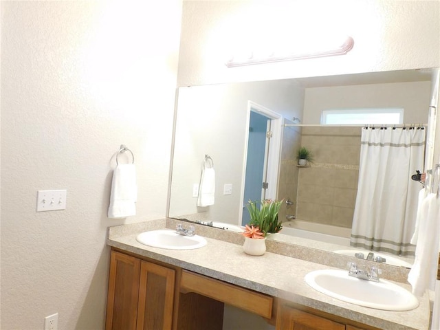 6036 SE 66th St, Oklahoma City, OK 73135 - bathroom featuring double vanity, a textured wall, and shower / tub combo with curtain