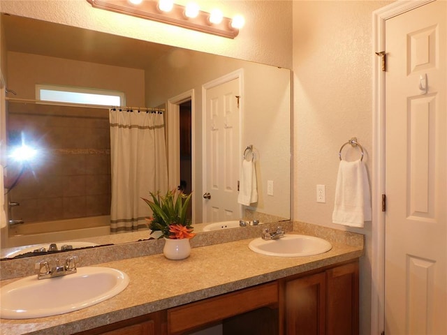 6036 SE 66th St, Oklahoma City, OK 73135 - full bathroom with double vanity, a textured wall, and shower / bath combo with shower curtain
