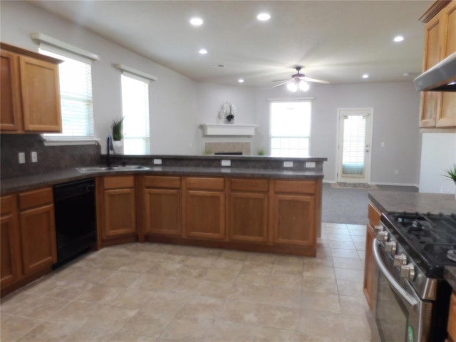 6036 SE 66th St, Oklahoma City, OK 73135 - kitchen featuring dishwasher, a ceiling fan, gas stove, dark countertops, and brown cabinetry
