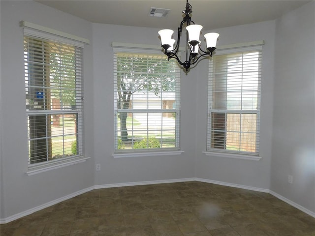 6036 SE 66th St, Oklahoma City, OK 73135 - unfurnished dining area featuring a chandelier and healthy amount of natural light