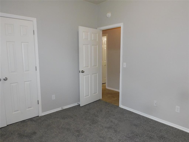 6036 SE 66th St, Oklahoma City, OK 73135 - unfurnished bedroom with dark carpet and baseboards