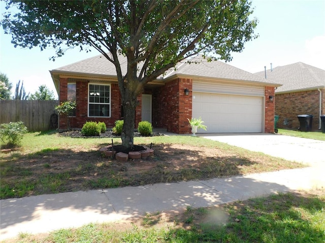 6036 SE 66th St, Oklahoma City, OK 73135 - ranch-style house with an attached garage, brick siding, and driveway
