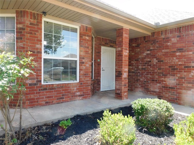 6036 SE 66th St, Oklahoma City, OK 73135 - view of exterior entry with covered porch and brick siding