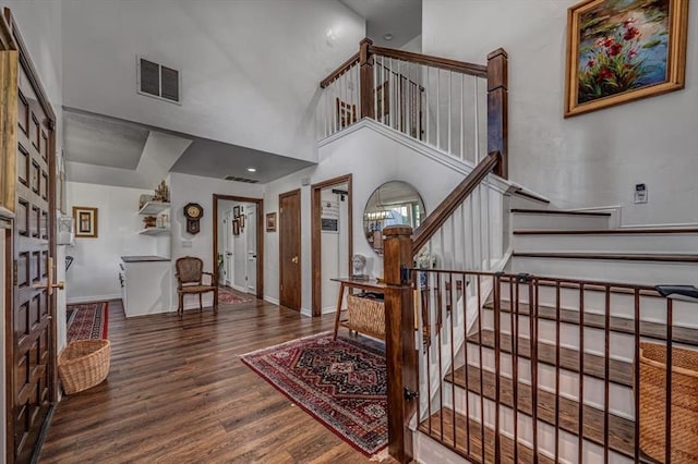 1601 Hazelhurst, Edmond, OK 73013 - foyer with wood finished floors, stairway, a towering ceiling, and french doors
