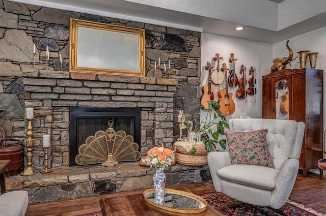 1601 Hazelhurst, Edmond, OK 73013 - living room with wood finished floors and a fireplace