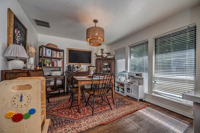 1601 Hazelhurst, Edmond, OK 73013 - dining space with baseboards and wood finished floors