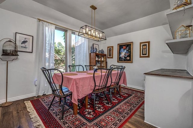 1601 Hazelhurst, Edmond, OK 73013 - dining space featuring wood finished floors and a chandelier