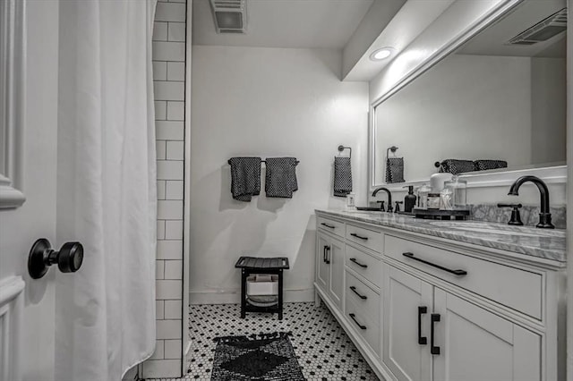 1601 Hazelhurst, Edmond, OK 73013 - bathroom with double vanity and a shower with curtain