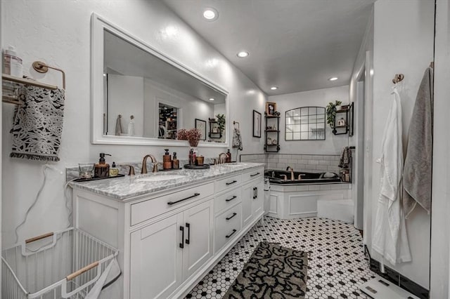 1601 Hazelhurst, Edmond, OK 73013 - bathroom with double vanity, recessed lighting, and a tub to relax in