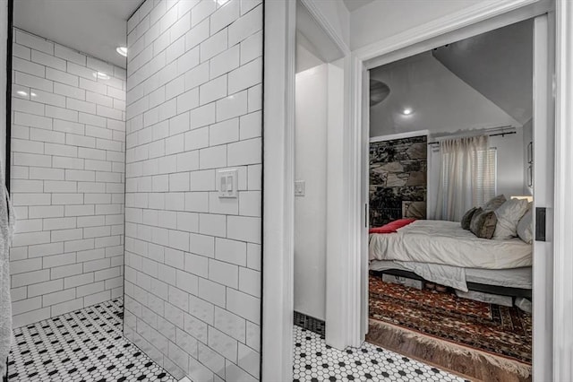 1601 Hazelhurst, Edmond, OK 73013 - ensuite bathroom with tiled shower and tile patterned flooring