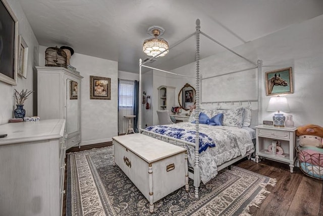 1601 Hazelhurst, Edmond, OK 73013 - bedroom with dark wood finished floors