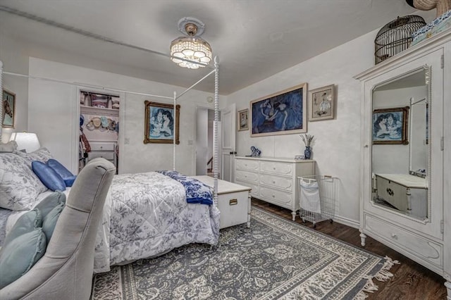 1601 Hazelhurst, Edmond, OK 73013 - bedroom with dark wood-type flooring and a closet