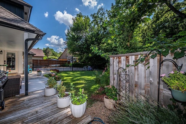 1601 Hazelhurst, Edmond, OK 73013 - wooden terrace featuring a fenced backyard