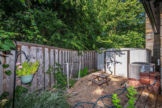 1601 Hazelhurst, Edmond, OK 73013 - fenced backyard with a storage unit