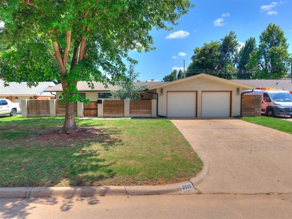 7716 NW 26th St, Bethany, OK 73008 - single story home with a garage, driveway, and brick siding