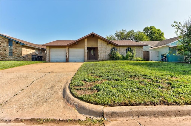 1021 SW 1st St, Moore, OK 73160 - view of front of house featuring a garage, driveway, a front lawn, and brick siding