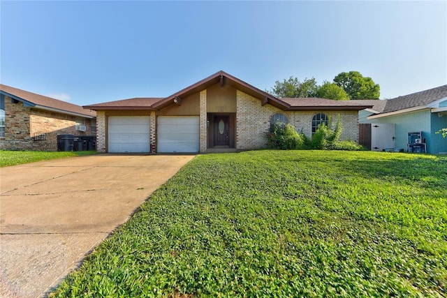 1021 SW 1st St, Moore, OK 73160 - mid-century inspired home featuring a garage, brick siding, a front lawn, and concrete driveway