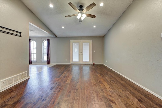 1021 SW 1st St, Moore, OK 73160 - empty room featuring french doors, dark wood-style floors, ceiling fan, recessed lighting, and a textured wall
