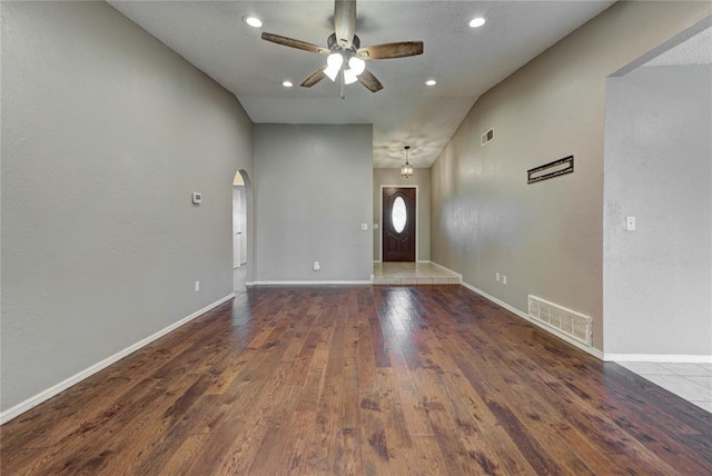 1021 SW 1st St, Moore, OK 73160 - unfurnished room featuring ceiling fan, arched walkways, wood finished floors, recessed lighting, and high vaulted ceiling