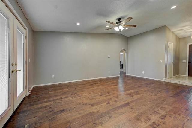 1021 SW 1st St, Moore, OK 73160 - empty room featuring arched walkways, ceiling fan, dark wood finished floors, and recessed lighting
